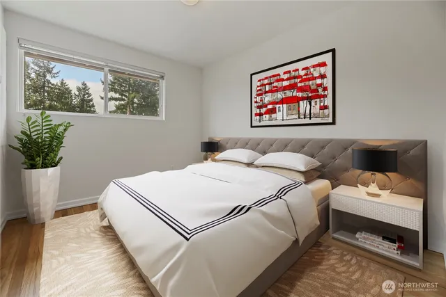 a bedroom with bed and a window