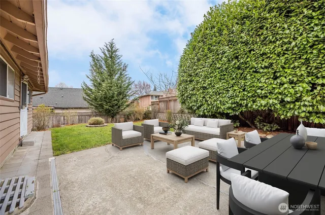 a view of a patio with couches and potted plants