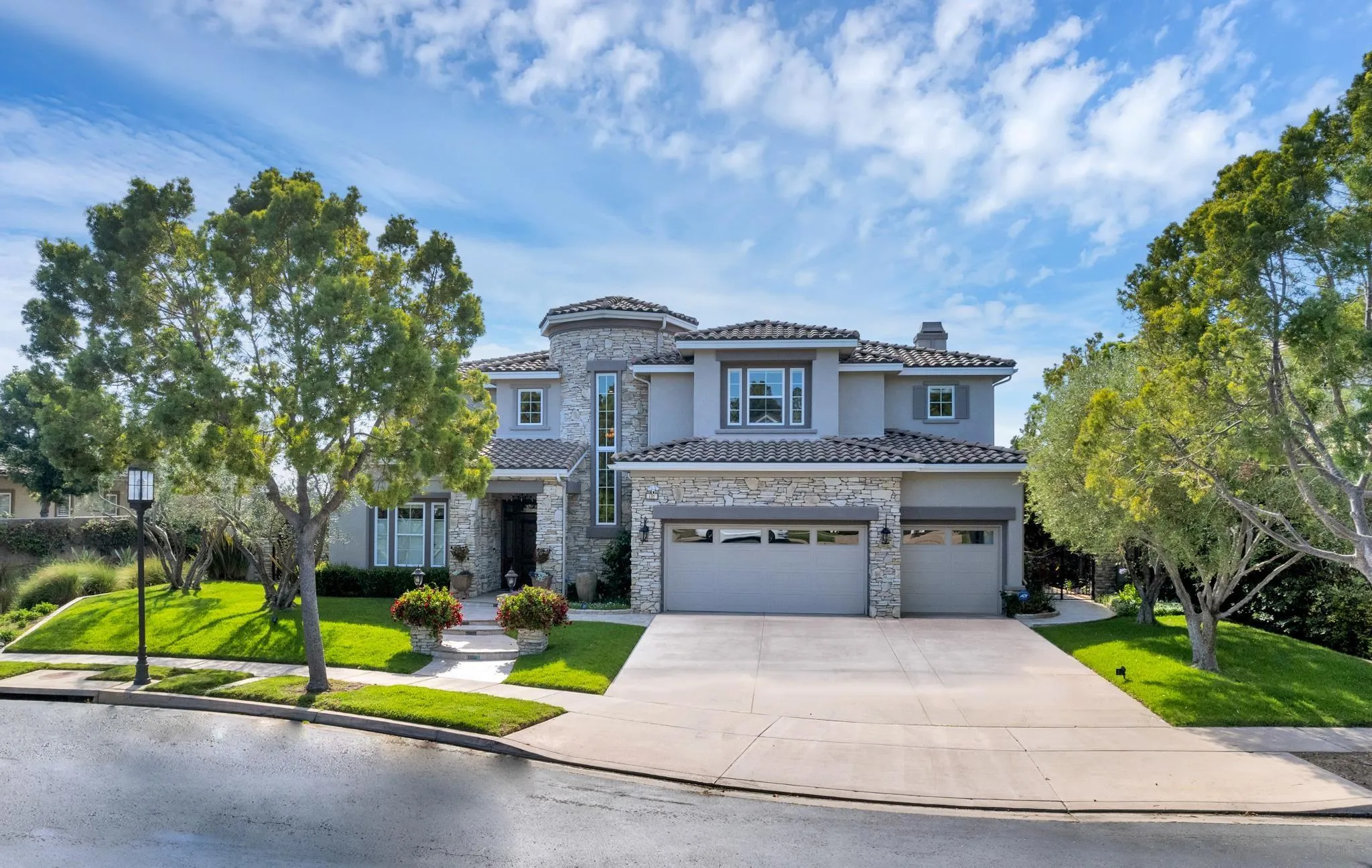 a view of backyard with swimming pool and seating space