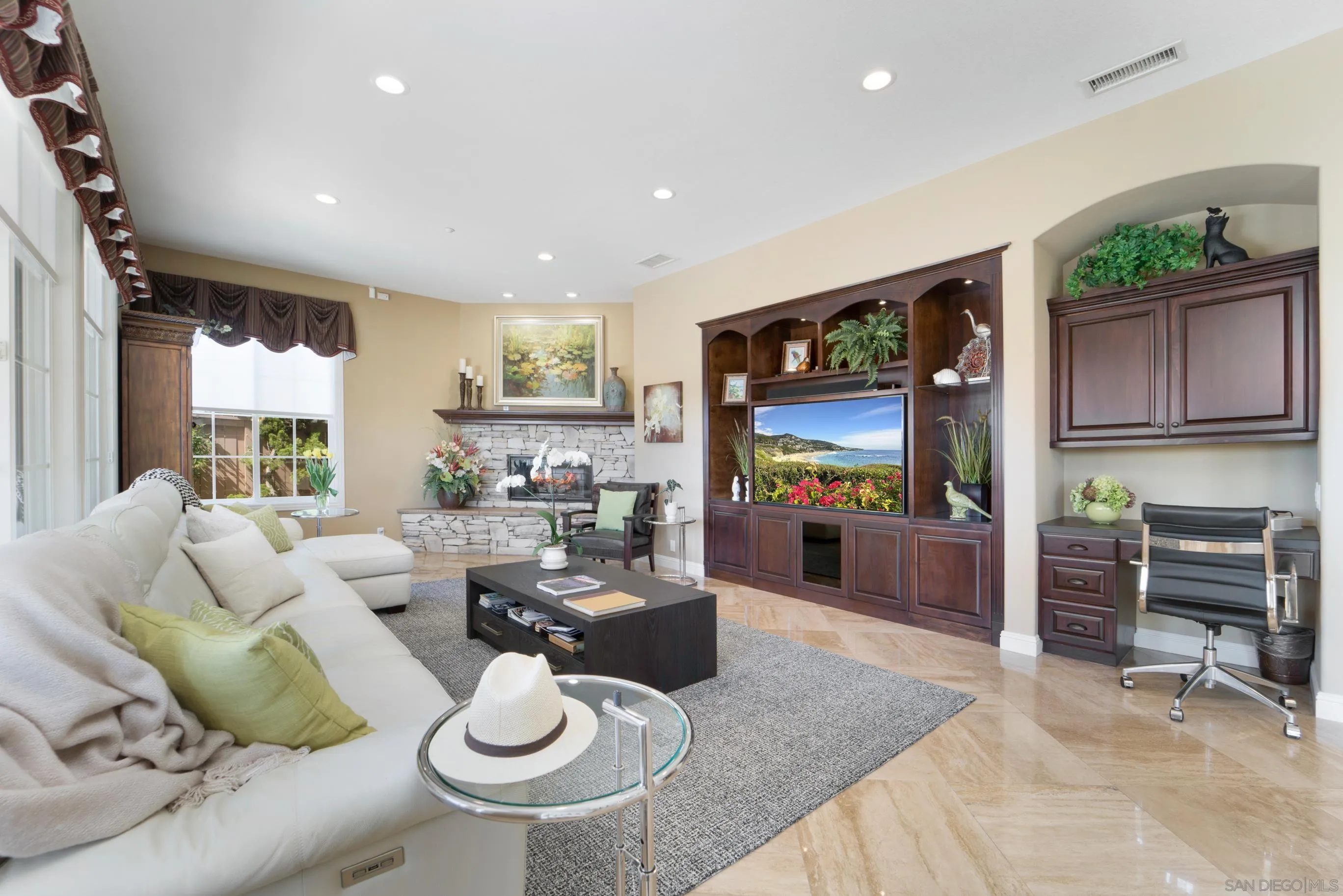698 Cypress Hills Drive Encinitas, CA 92024 - Photo 11 of 67 a living room with furniture and a flat screen tv