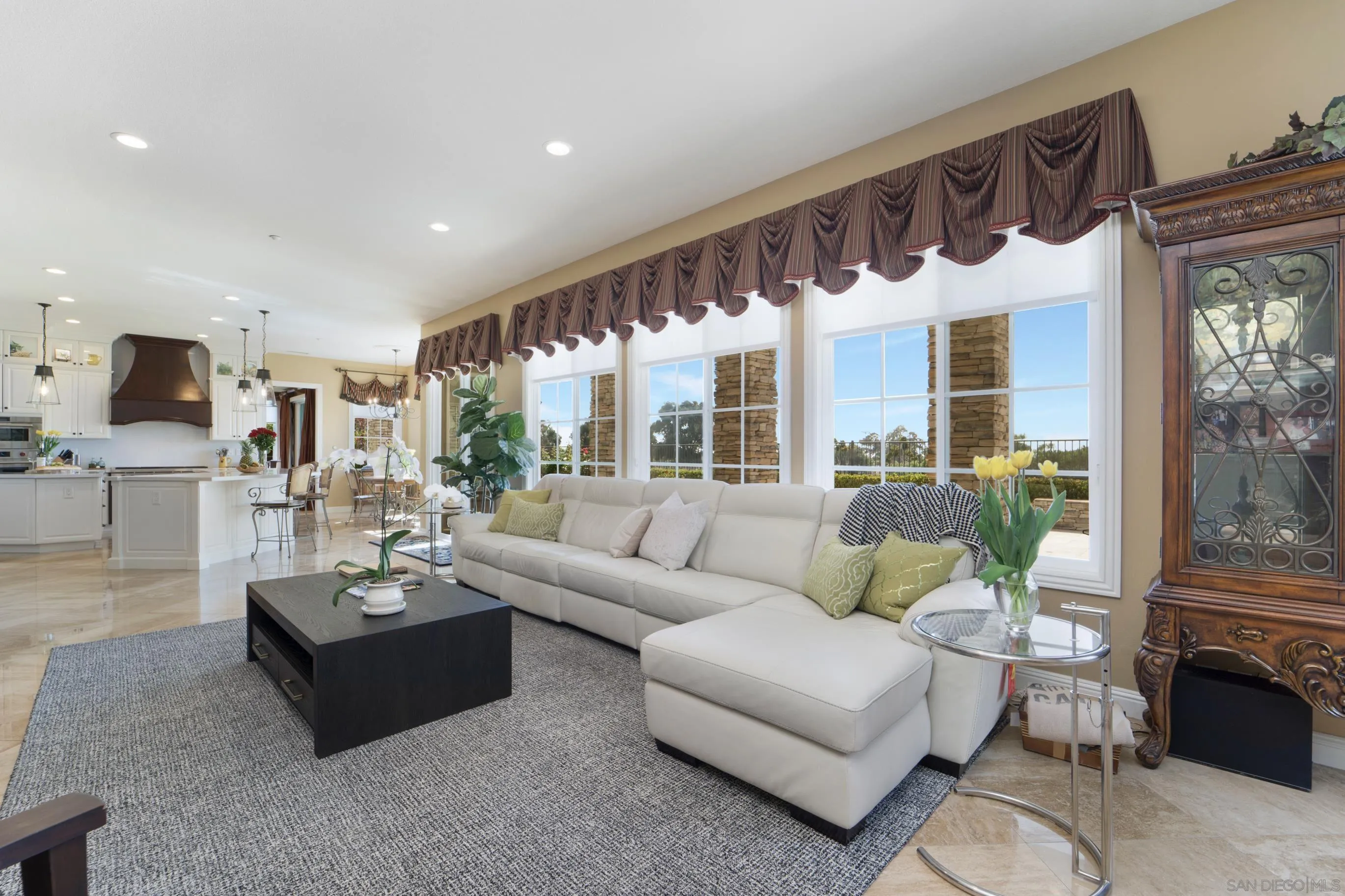 698 Cypress Hills Drive Encinitas, CA 92024 - Photo 13 of 67 a living room with furniture fireplace and a large window