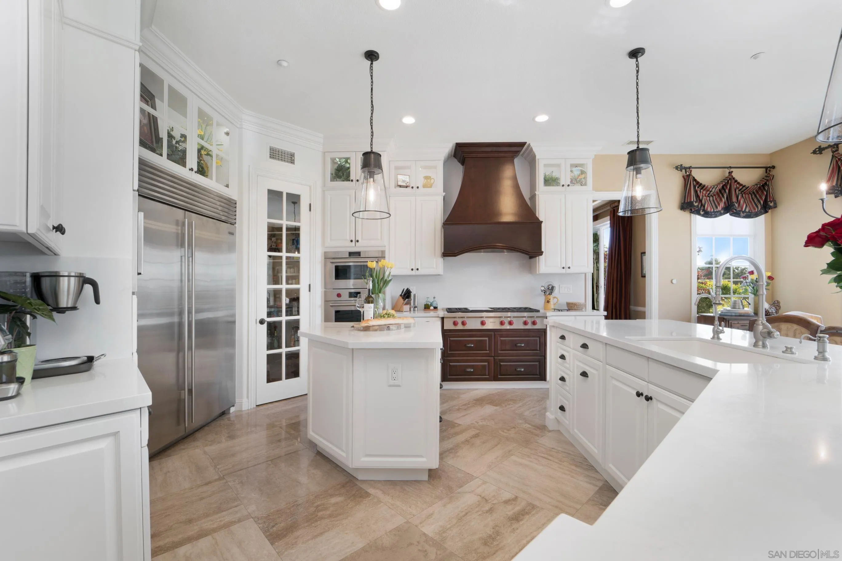698 Cypress Hills Drive Encinitas, CA 92024 - Photo 16 of 67 a kitchen with stainless steel appliances granite countertop a refrigerator a oven a stove and a sink