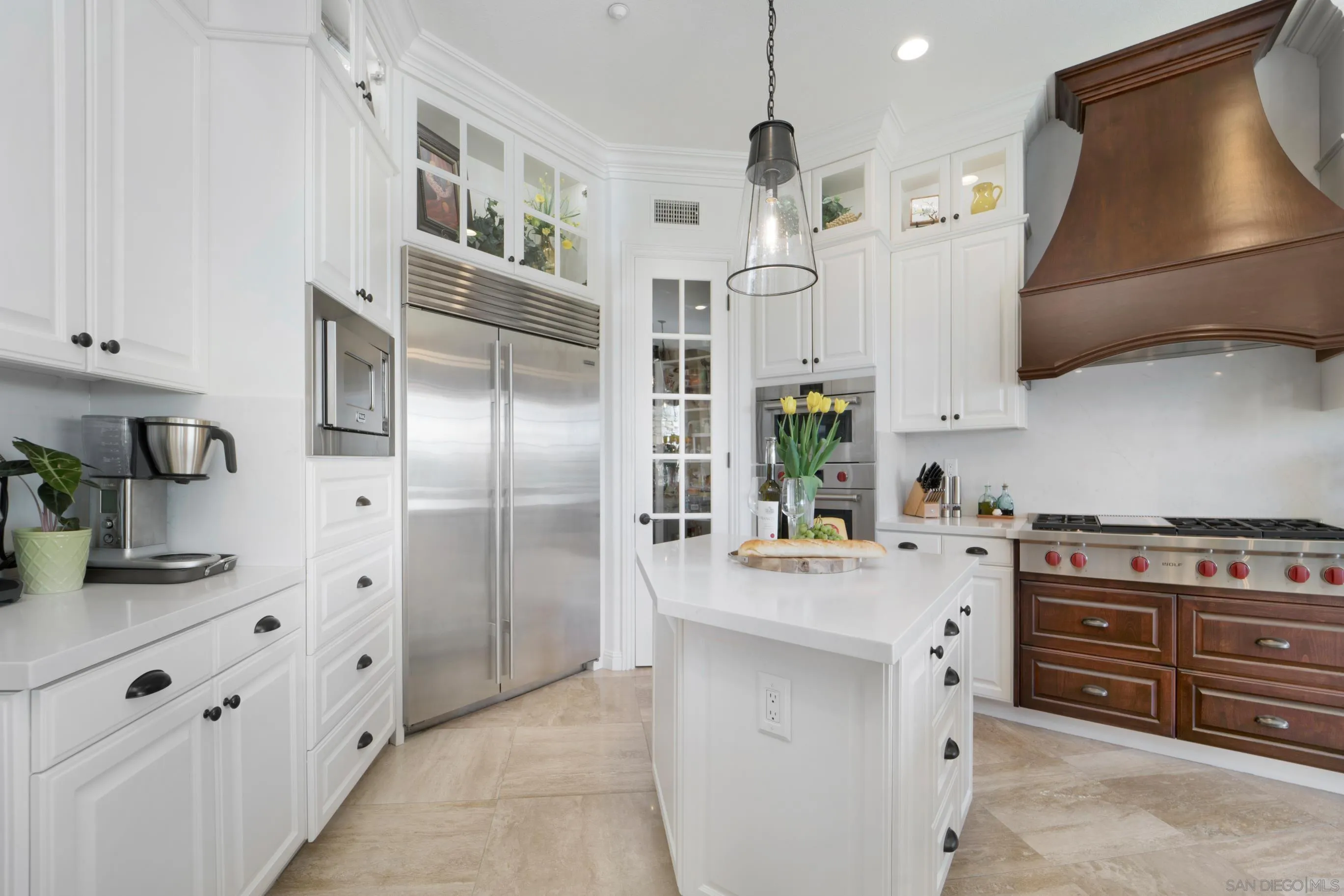 698 Cypress Hills Drive Encinitas, CA 92024 - Photo 17 of 67 a kitchen with stainless steel appliances a stove a sink and a refrigerator