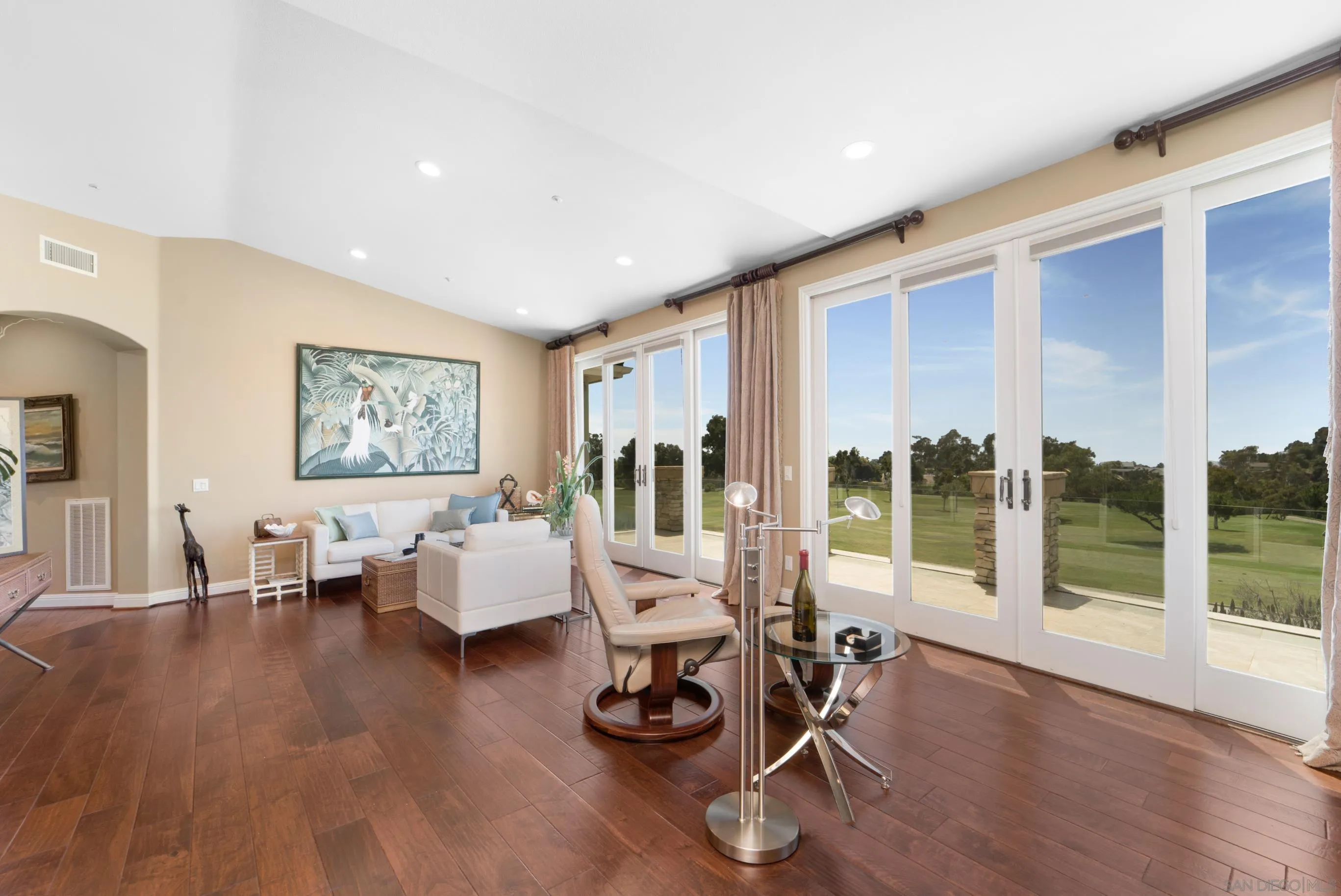 698 Cypress Hills Drive Encinitas, CA 92024 - Photo 22 of 67 a living room with furniture and wooden floor