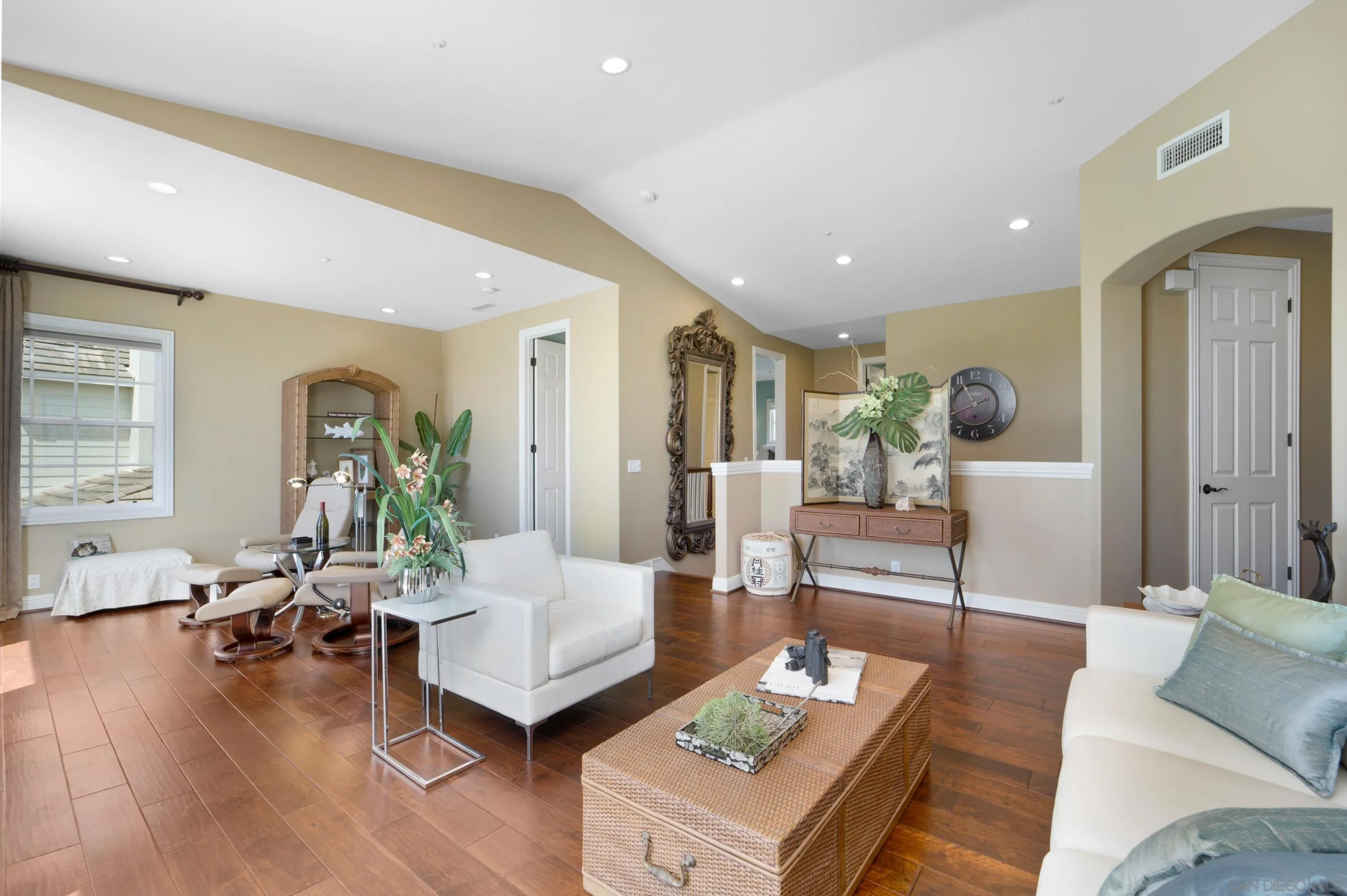 698 Cypress Hills Drive Encinitas, CA 92024 - Photo 24 of 67 a living room with furniture and wooden floor