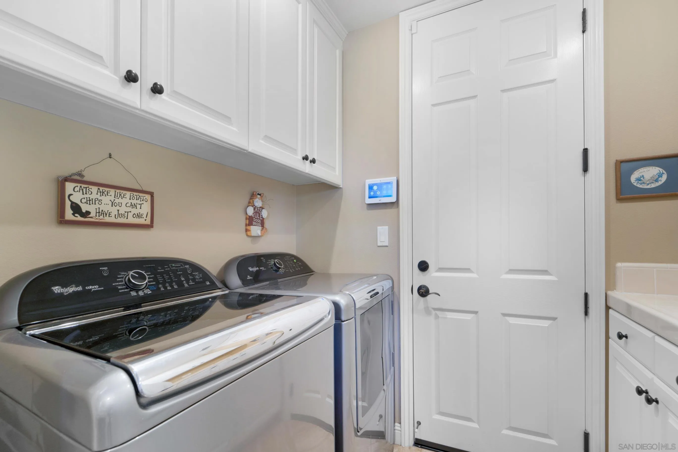 698 Cypress Hills Drive Encinitas, CA 92024 - Photo 42 of 67 a utility room with dryer and washer