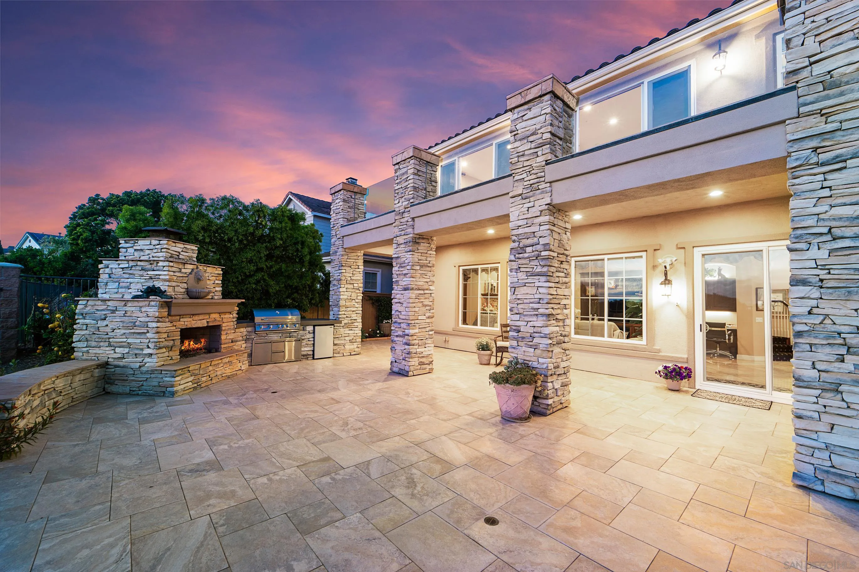 698 Cypress Hills Drive Encinitas, CA 92024 - Photo 49 of 67 a view of a patio with dining table and chairs with wooden fence