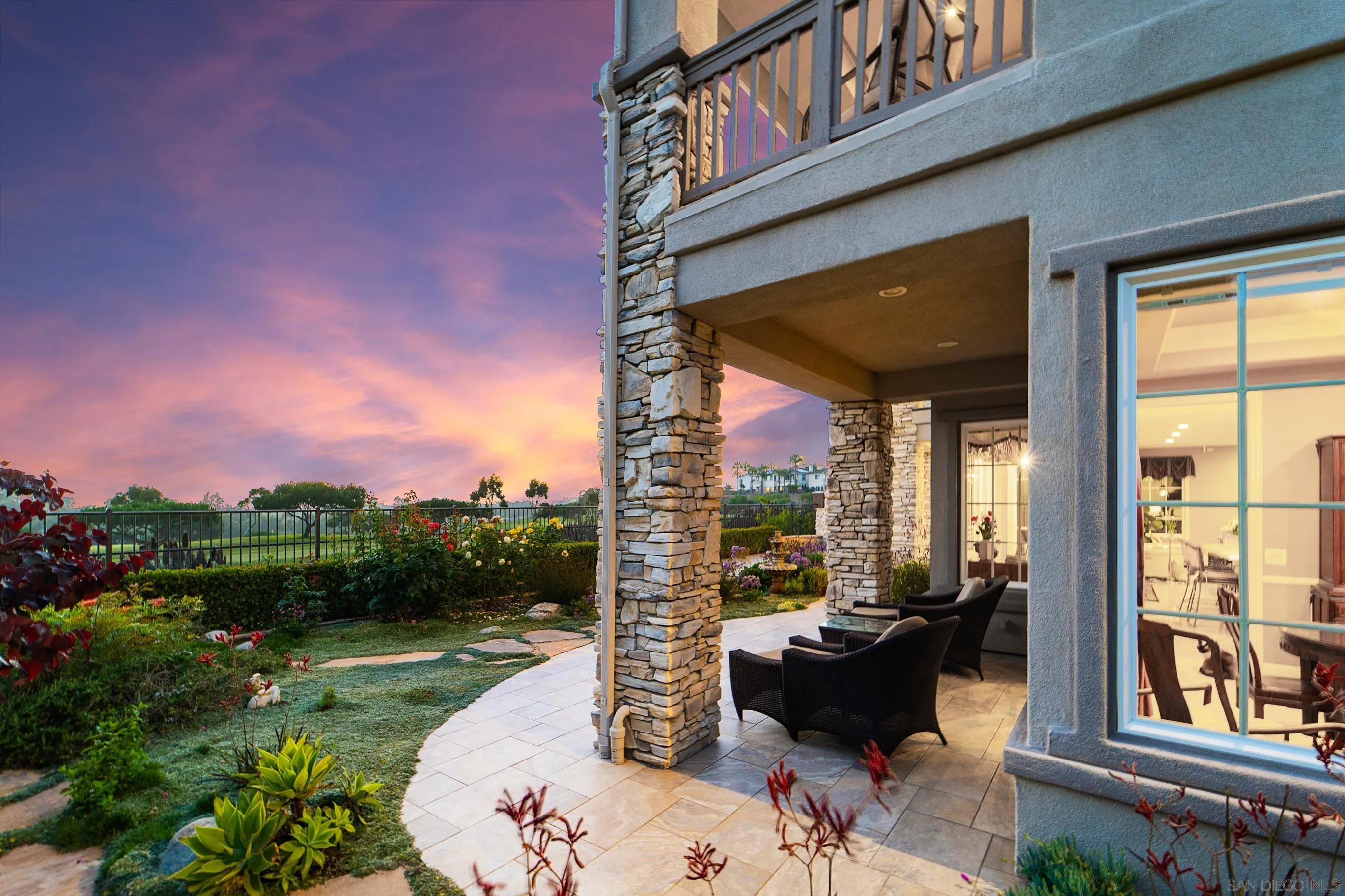 698 Cypress Hills Drive Encinitas, CA 92024 - Photo 53 of 67 a view of a patio with couches table and chairs and potted plants