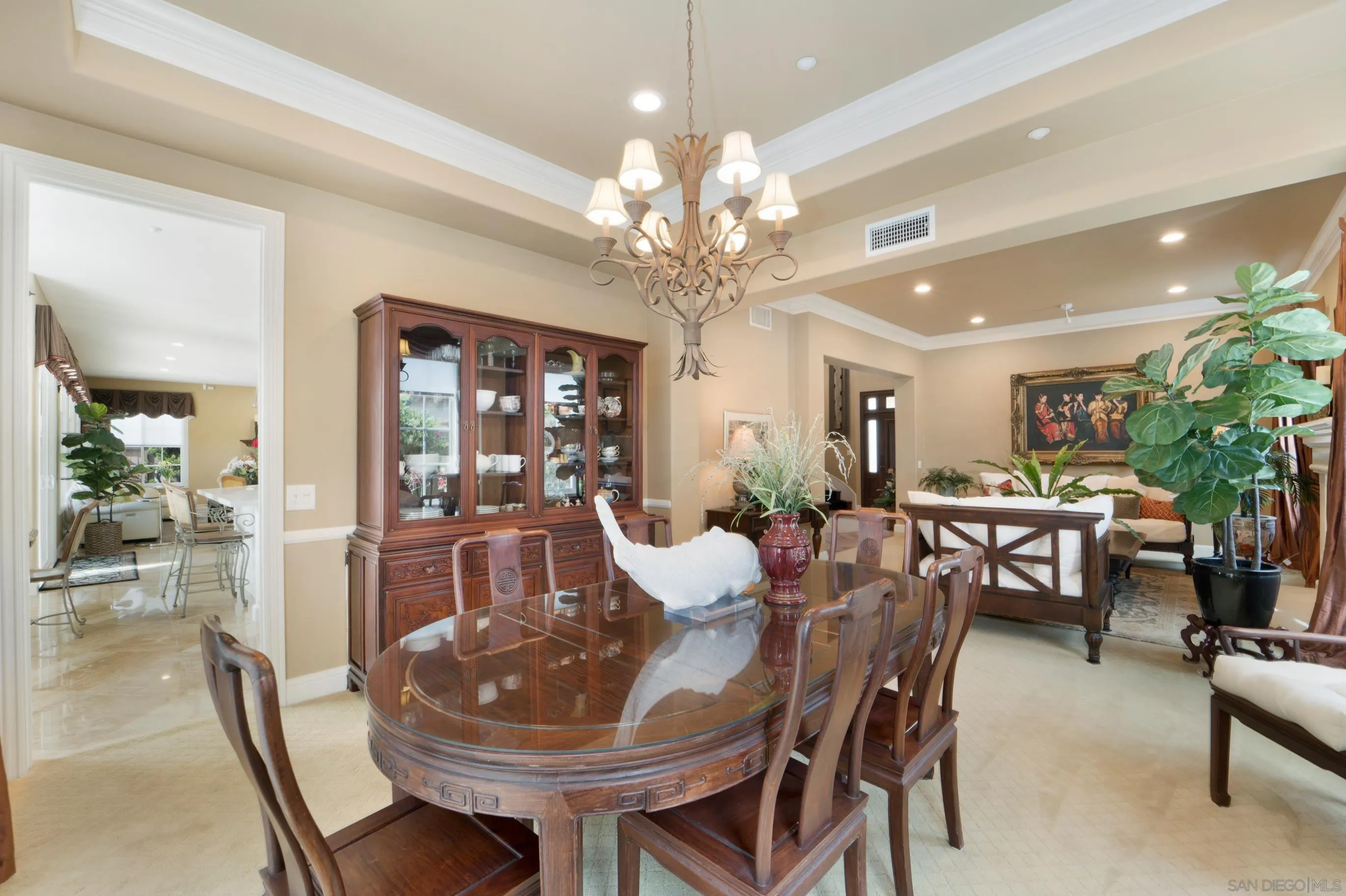 698 Cypress Hills Drive Encinitas, CA 92024 - Photo 7 of 67 a view of a dining room with furniture and chandelier