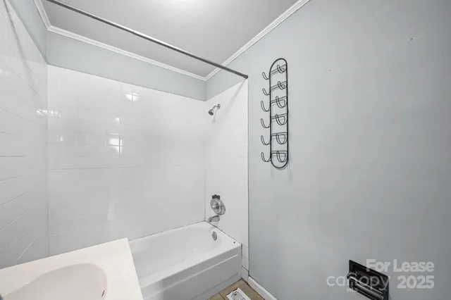 a bathroom with a bathtub a toilet and a shower