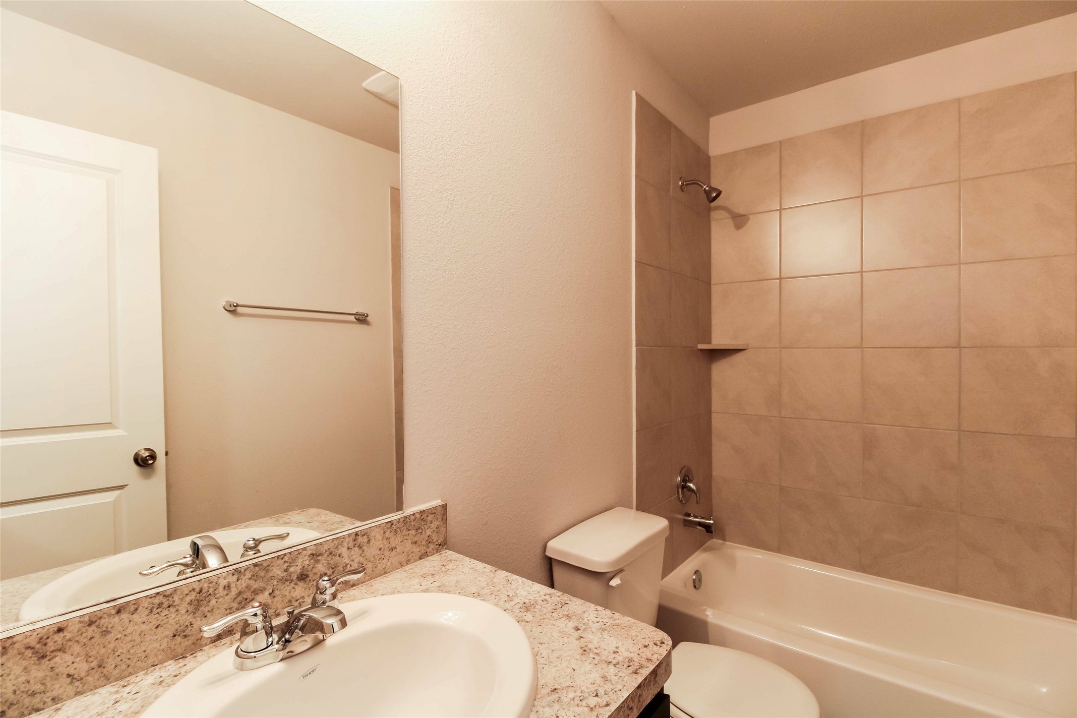 2528 Shad Drive Conroe, TX 77384 - Photo 7 of 16 a bathroom with a granite countertop sink toilet and shower