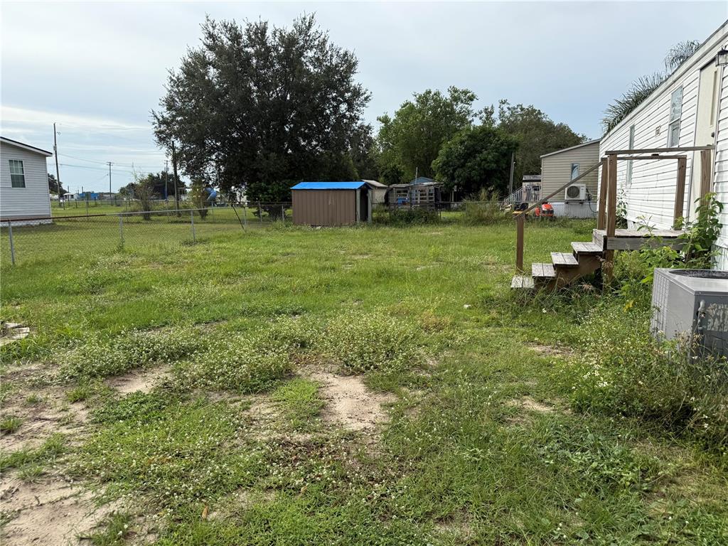 340 South Hankin Road Bartow, FL 33830 - Photo 15 of 16 a backyard of a house with lots of green space