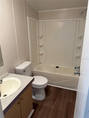 a bathroom with a sink a toilet and a bathtub