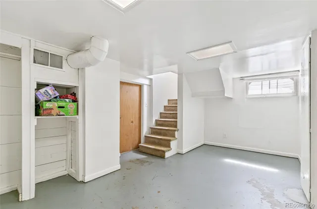 a view of a refrigerator in kitchen and wooden floor