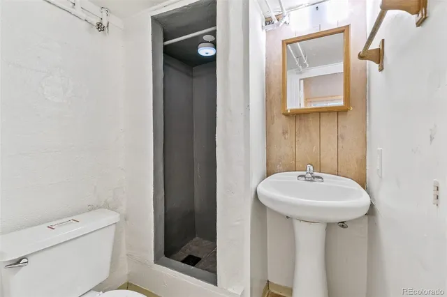 a view of a hallway and a bathroom