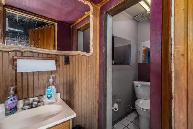 a view of bathroom with a toilet and a sink