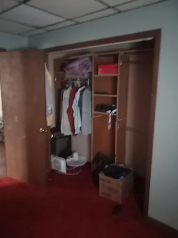 a room with furniture and wooden floor