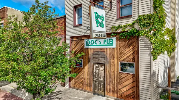 a sign on a pole on a street