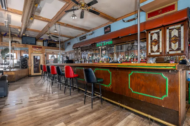 a view of a chairs and table in a room