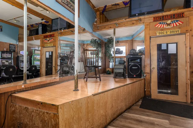 a view of a kitchen with a sink and cabinets