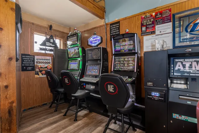 a front view of a house with outdoor seating