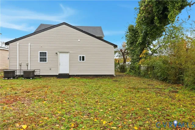 a view of a backyard of the house