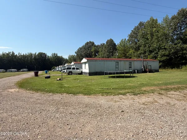 a view of an house with a yard