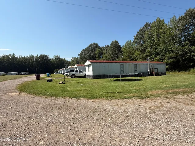 a view of an house with a yard