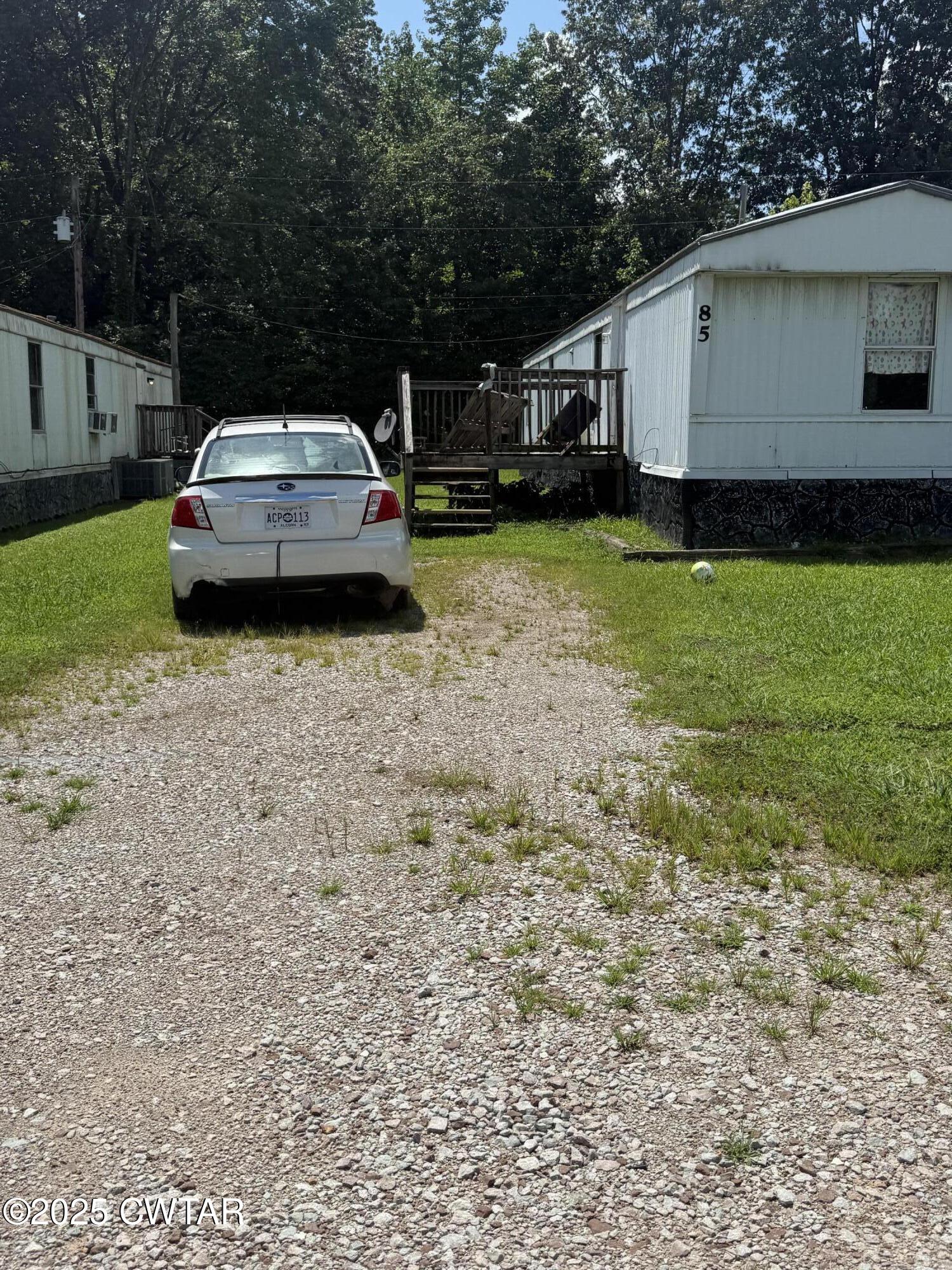 0 Skylar Way Middleton, TN 38052 - Photo 4 of 11 a car parked in front of white house
