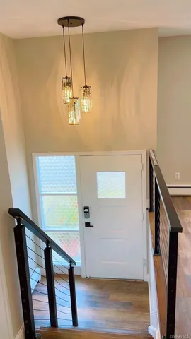 a view of entryway with wooden floor
