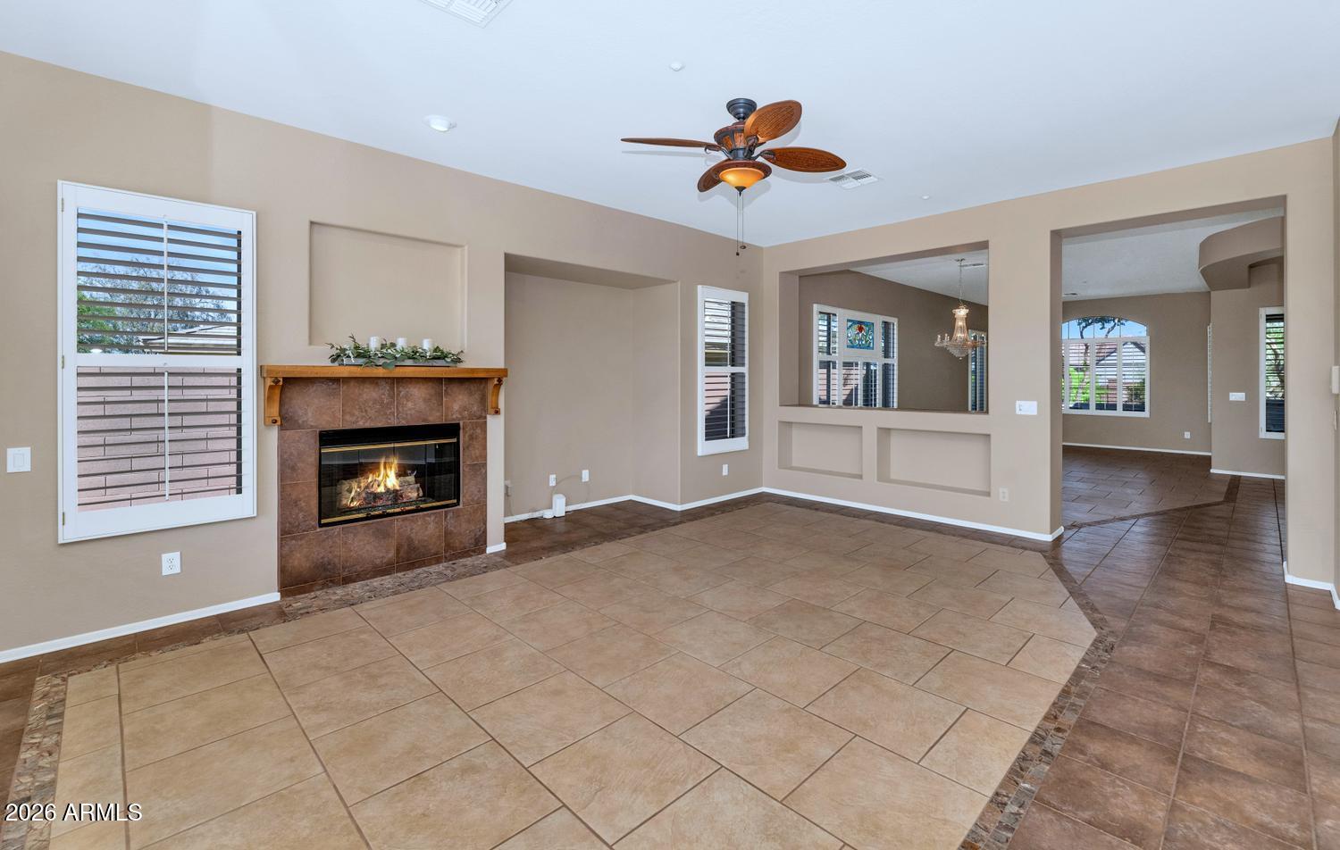 41123 North River Bend Road Phoenix, AZ 85086 - Photo 14 of 45 a view of an empty room with a fireplace and a window