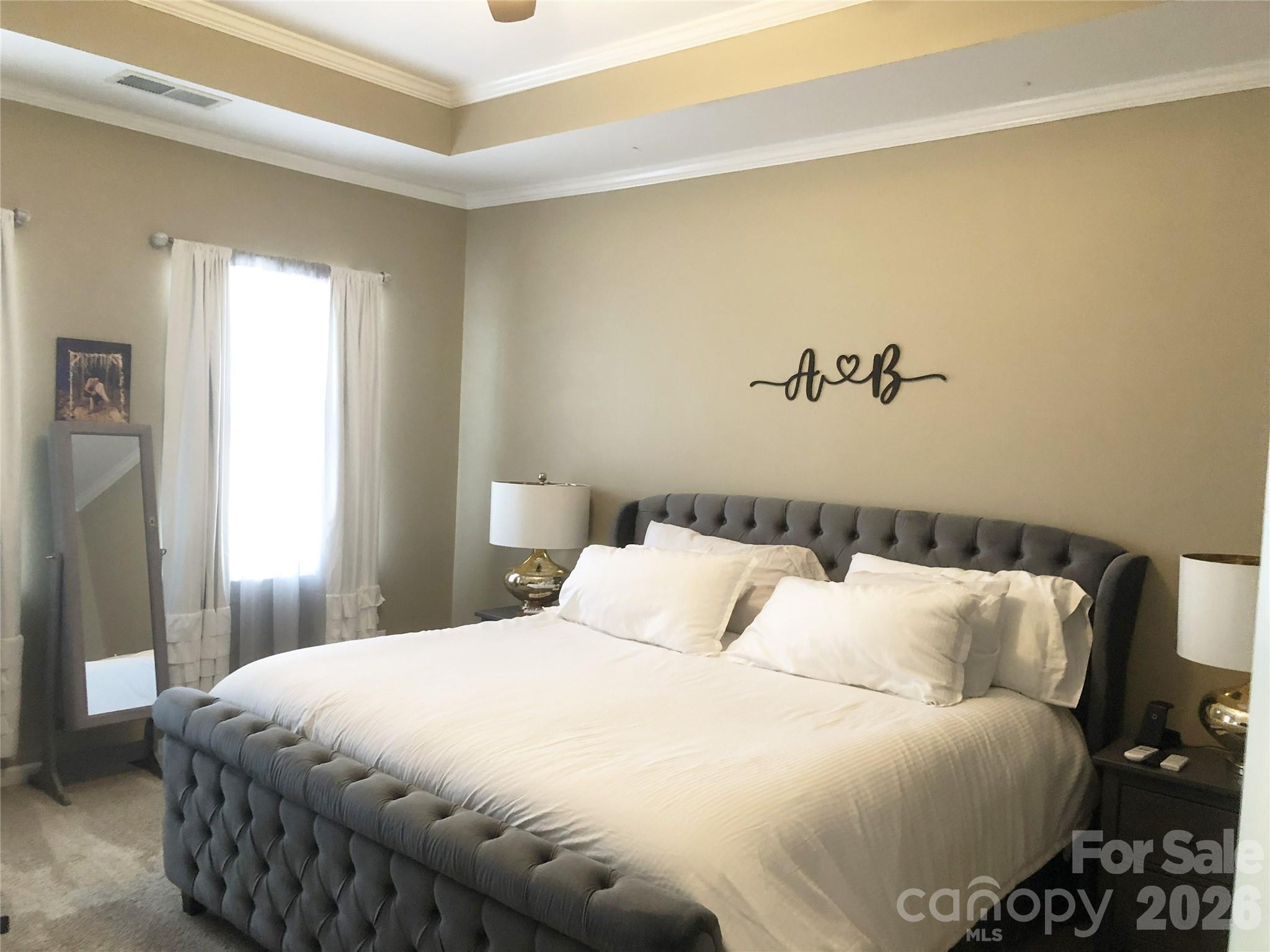 223 Butterfly Place Fort Mill, SC 29708 - Photo 10 of 21 a bedroom with a bed and a table