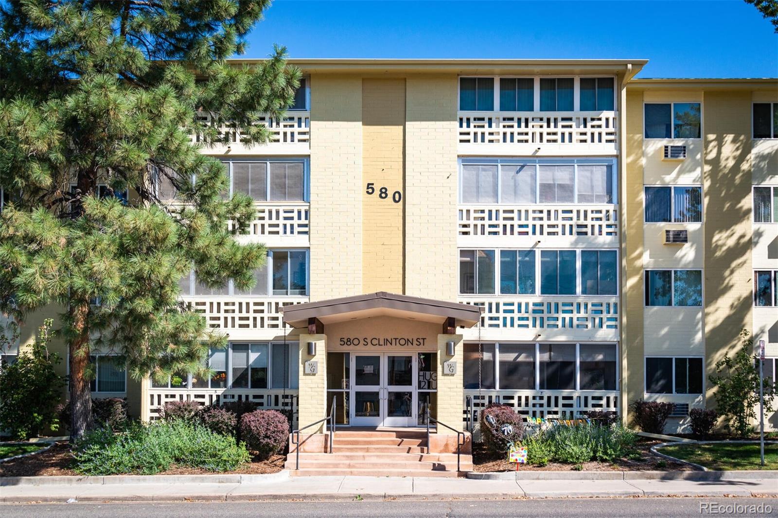 580 South Clinton Street, Unit 9B Denver, CO 80247 - Photo 3 of 30 a front view of a multi story building