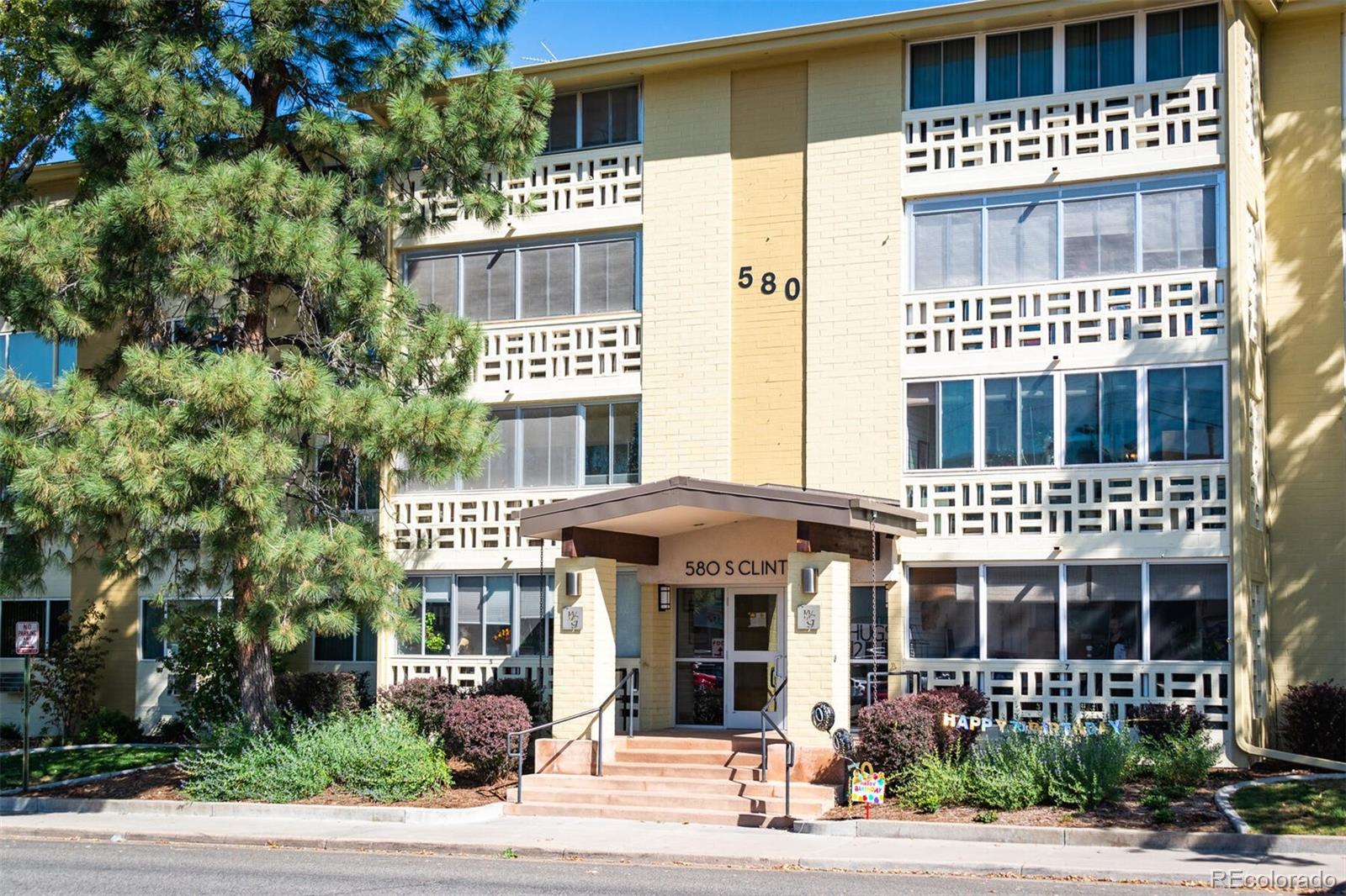 580 South Clinton Street, Unit 9B Denver, CO 80247 - Photo 4 of 30 a front view of a multi story building