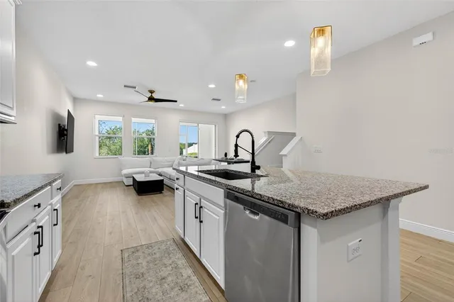 a kitchen with a sink and a stove