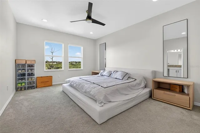 a bedroom with a bed and a couch