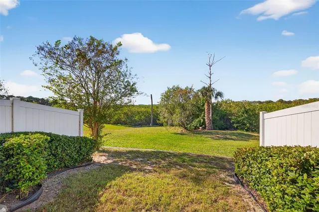 an aerial view of a houses with a swimming pool