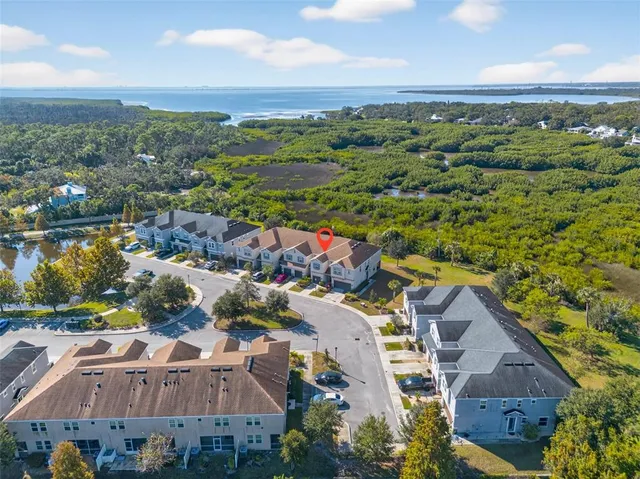 an aerial view of a city with lake view