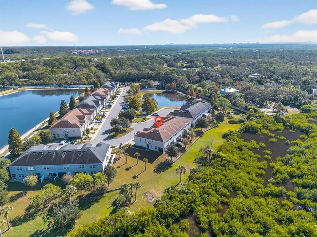 an aerial view of a house with outdoor space