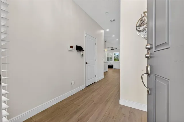 a view of an entryway with wooden floor
