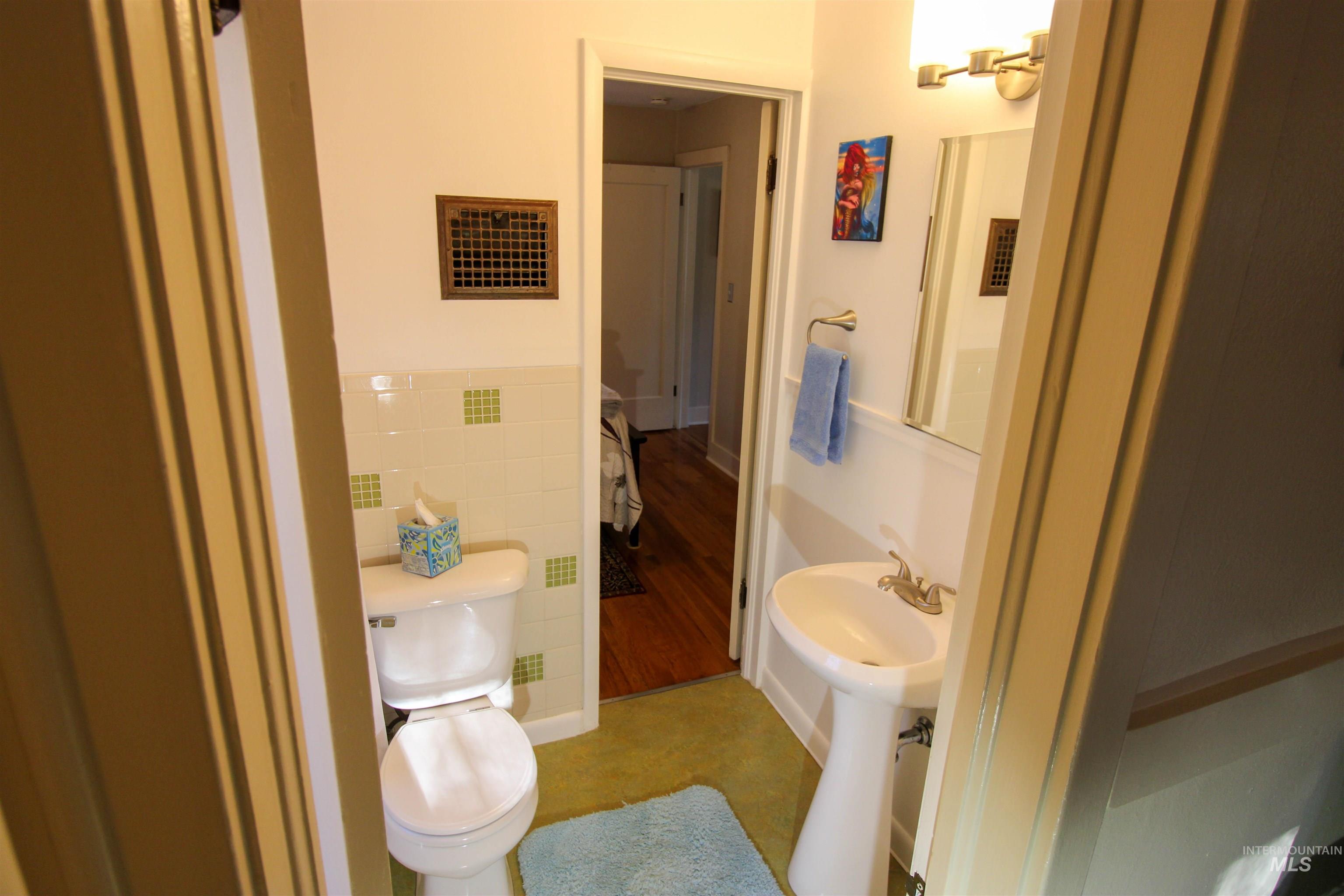 2551 West Hill Road Boise, ID 83702 - Photo 14 of 24 Bathroom featuring tile walls and finished concrete floors