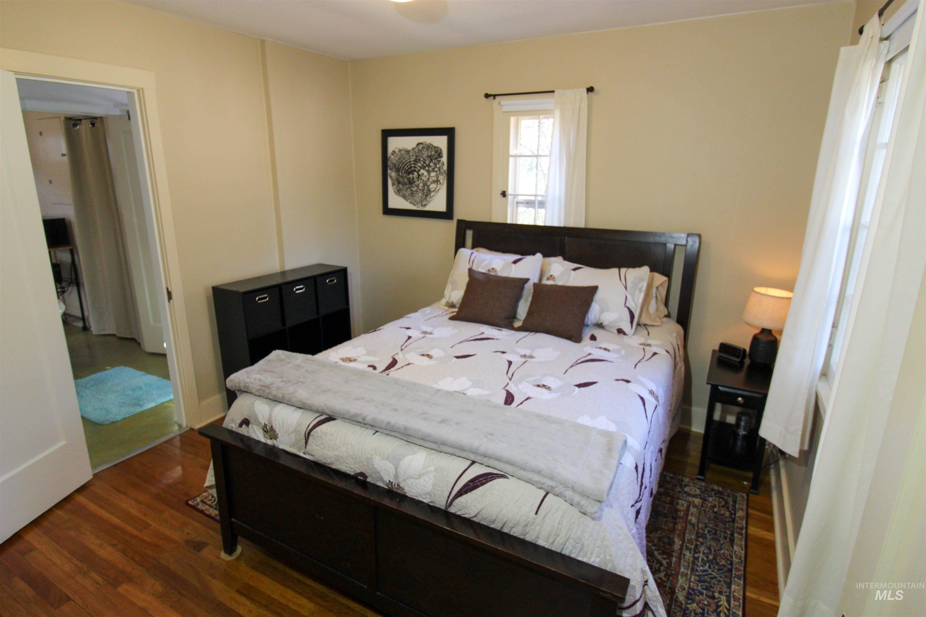 2551 West Hill Road Boise, ID 83702 - Photo 16 of 24 Bedroom featuring dark wood-type flooring