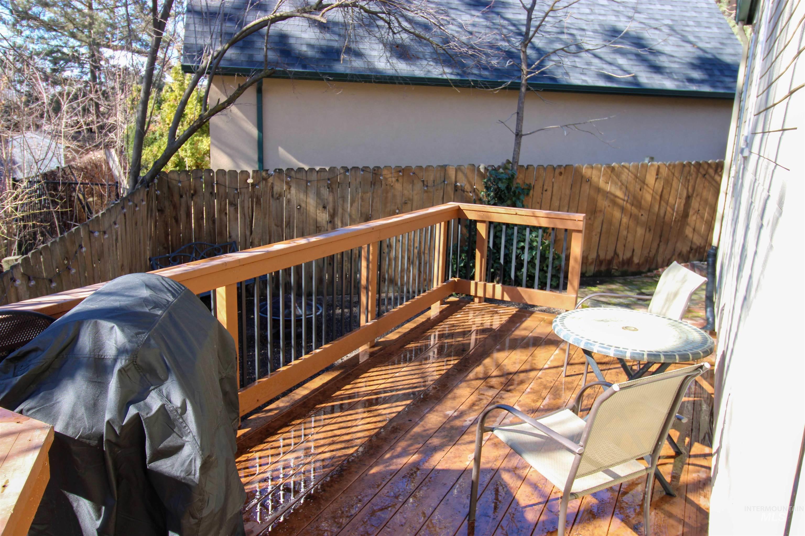 2551 West Hill Road Boise, ID 83702 - Photo 18 of 24 Wooden terrace with a fenced backyard and a grill