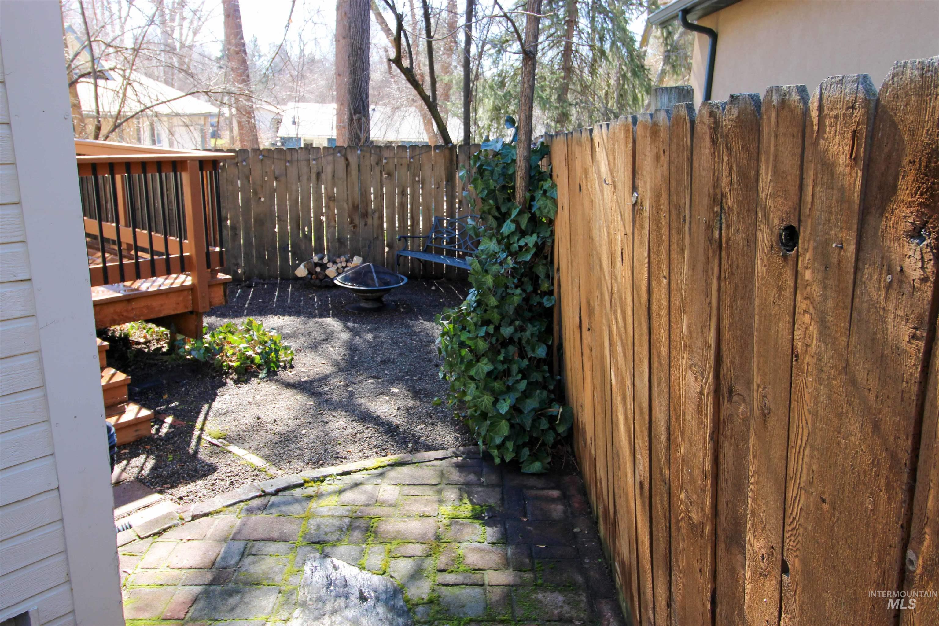 2551 West Hill Road Boise, ID 83702 - Photo 21 of 24 Fenced backyard featuring a wooden deck