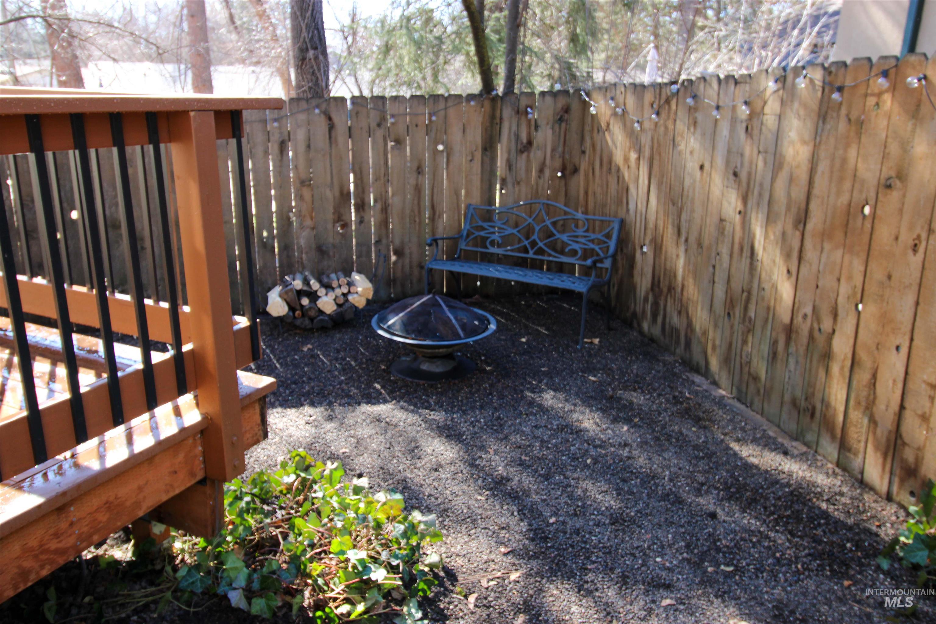 2551 West Hill Road Boise, ID 83702 - Photo 22 of 24 Fenced backyard featuring an outdoor fire pit