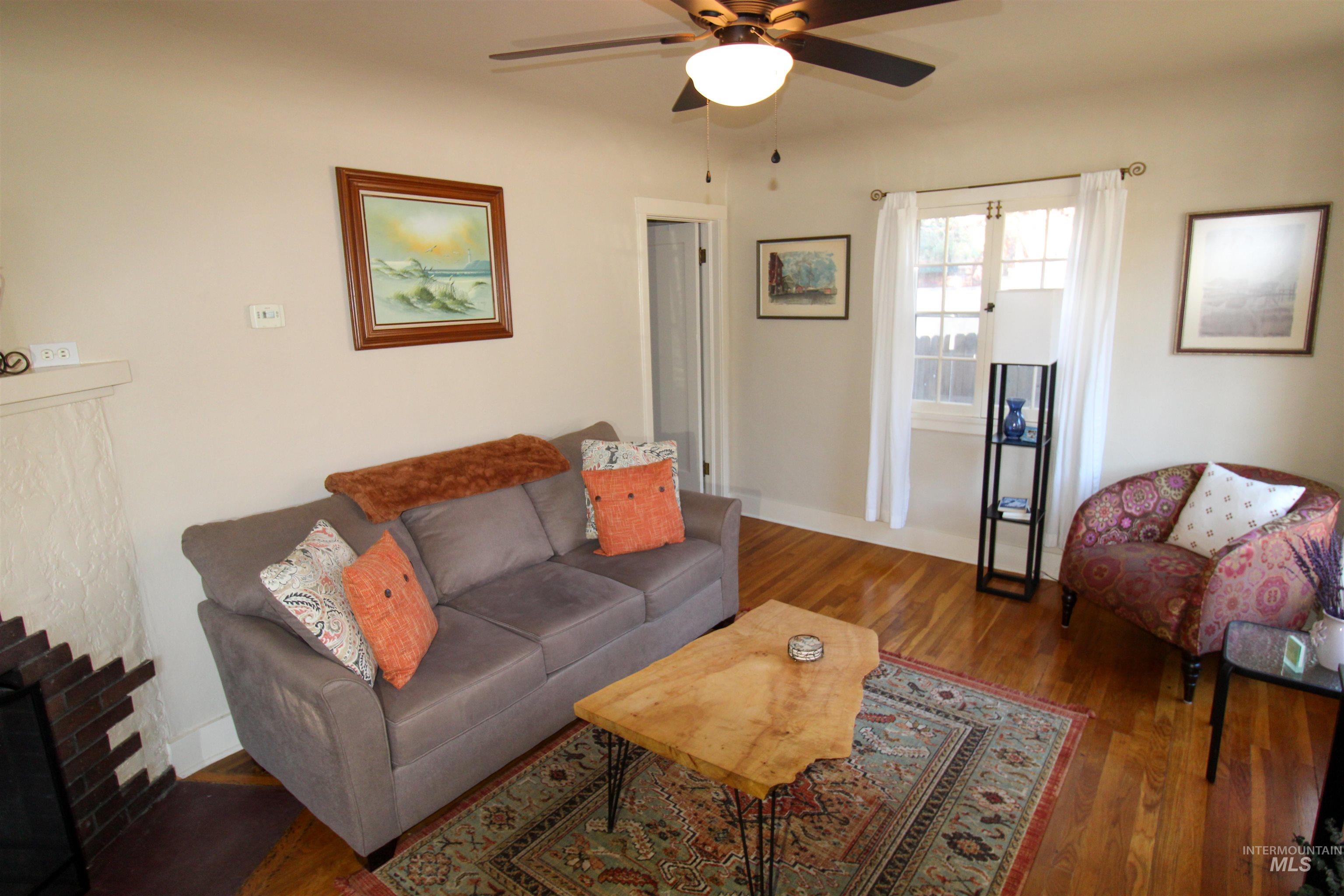 2551 West Hill Road Boise, ID 83702 - Photo 7 of 24 Living room with hardwood / wood-style flooring and ceiling fan