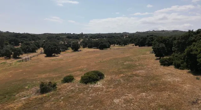 a view of a large body of mountains in a field