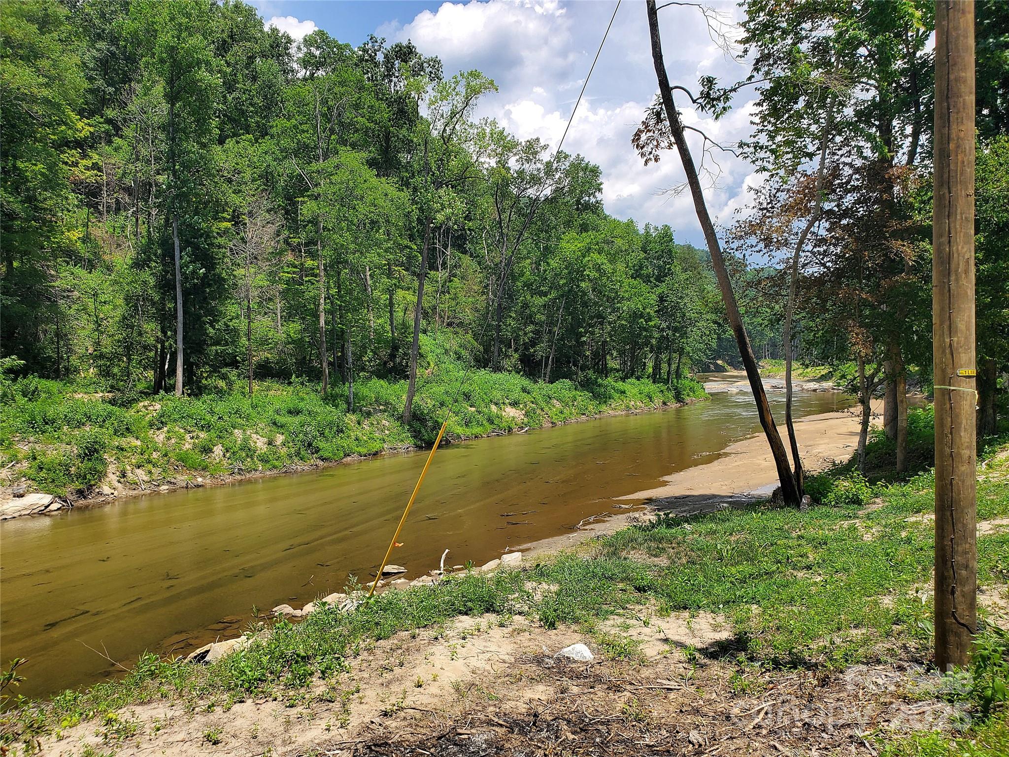 0 Green River Cove Road Saluda, NC 28773 - Photo 16 of 31 a view of a lake with a yard