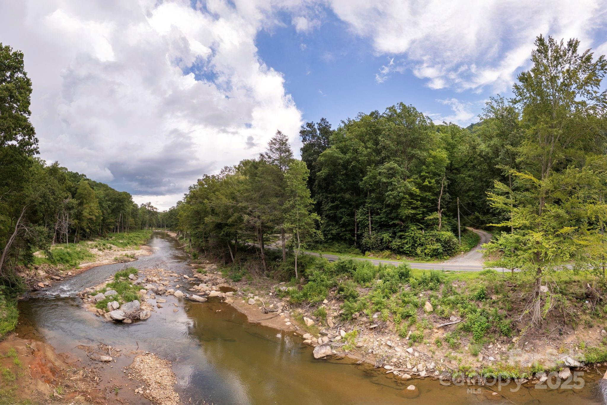 0 Green River Cove Road Saluda, NC 28773 - Photo 17 of 31 a view of a lake with a yard
