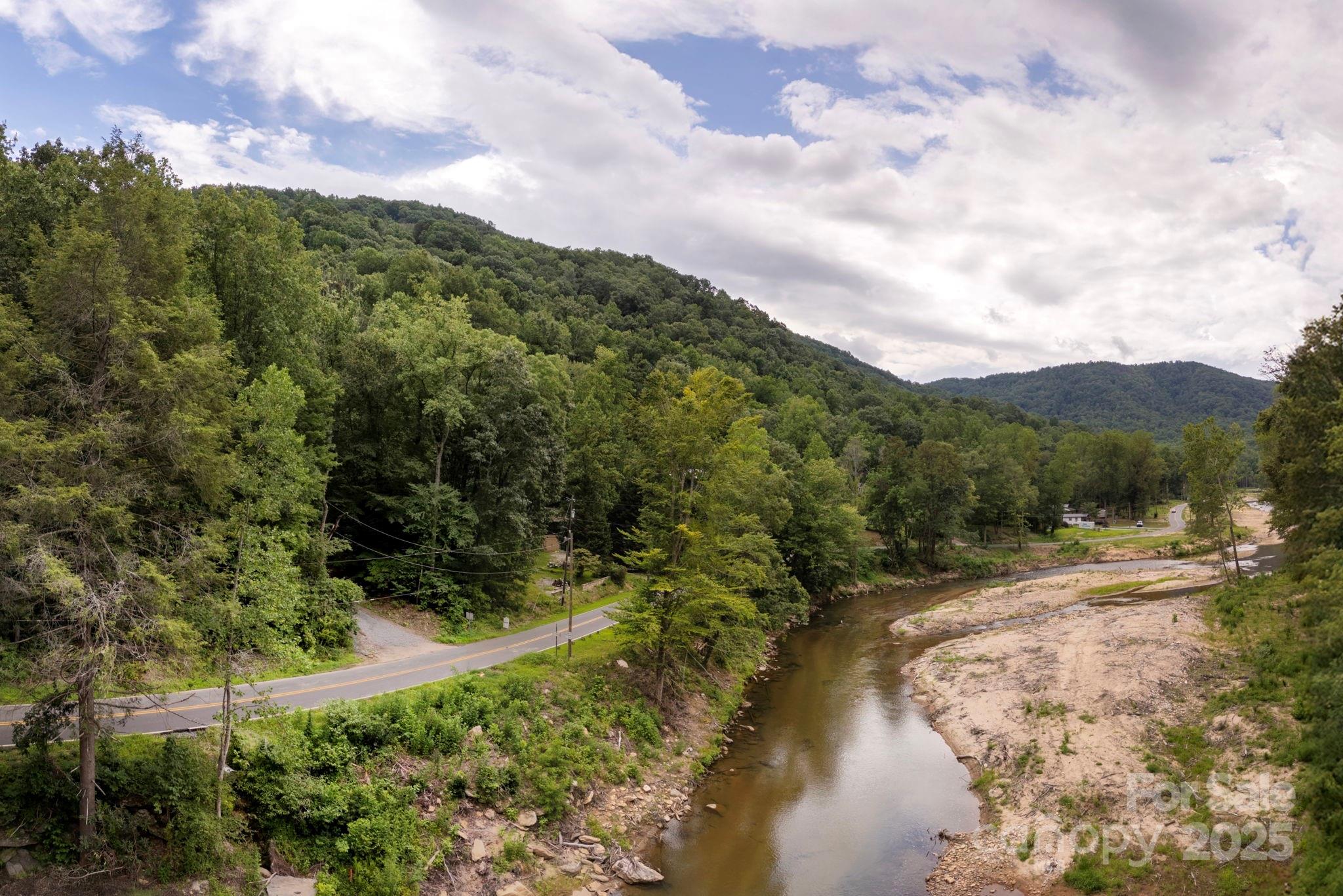 0 Green River Cove Road Saluda, NC 28773 - Photo 18 of 31 a view of a lake with mountains in the background